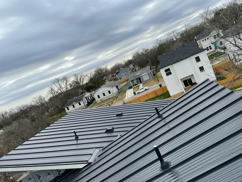 Standing seam metal roof panels with vents for Skylight Repair in Granby